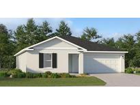 One-story home with white siding, black shutters, and a two-car garage at 1330 Inkberry Cir, Deland, FL 32720