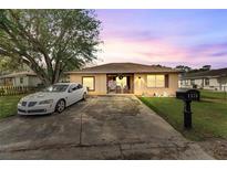 Cute one-story home with a landscaped yard and driveway at 1375 6 Iron Dr, Lakeland, FL 33801