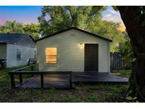 Newly renovated house exterior with deck and landscaping at 2619 Annandale Ave, Orlando, FL 32810