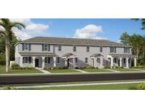 Three-unit townhome building with front porches and neutral color palette at 2651 Candied Apple Aly, Kissimmee, FL 34744