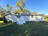Ranch style home with a large yard at 4805 Sand Mountain Loop Rd, Auburndale, FL 33823
