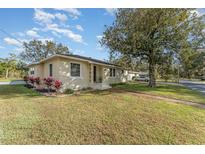 Single-story home with landscaping and a welcoming front entrance at 2104 W End Ave, Lakeland, FL 33803