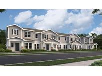Attractive row of townhomes with covered entries and landscaped yards at 7005 Rosy Sky Ave, Orlando, FL 32829