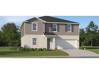 Two-story home with neutral siding, a two-car garage, and a landscaped lawn at 829 Hour Glass Rd, Lakeland, FL 33801