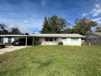 Ranch style home with carport and spacious yard at 2409 W Central Ave, Winter Haven, FL 33880