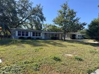 Gray Ranch home with mature landscaping at 2331 Olney Rd, Lakeland, FL 33801