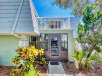 Condo with private balcony and lush landscaping at 4150 S Atlantic Ave # 107C, New Smyrna Beach, FL 32169