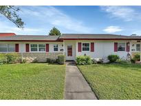 Cozy ranch-style home with red shutters and stone accents at 217 N Hill Ave # 20, Deland, FL 32724