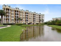 Building exterior overlooking a pond at 4672 Riverwalk Village Ct # 8201, Ponce Inlet, FL 32127