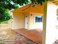 Cozy front porch with a newly painted exterior at 854 Derbyshire Rd, Daytona Beach, FL 32117