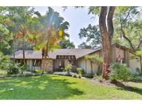 Charming one-story home nestled in lush landscaping with a spacious yard at 121 Willow Bend Ln, Ormond Beach, FL 32174