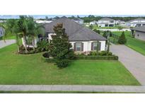 Luxury home with manicured landscaping and a paved driveway at 2273 Grayling St, Orlando, FL 32820