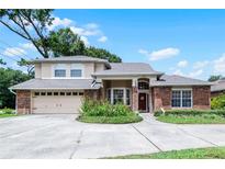 Two story brick home with attached garage at 1401 Bent Oaks Blvd, Deland, FL 32724