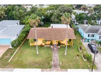 Aerial view of charming ranch house with brick walkway at 232 Williams Ave, Daytona Beach, FL 32118