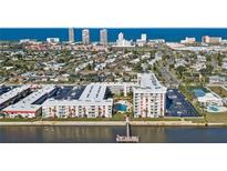 Aerial view of waterfront condo community with pool and private pier at 2711 N Halifax Ave # 296, Daytona Beach, FL 32118