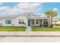 Charming two-story home with front porch and landscaping at 623 Margaritaville Ave, Daytona Beach, FL 32124