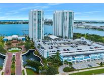 An aerial view of a luxurious waterfront condo complex with two high-rise towers and ample parking at 231 Riverside Dr # 307-1, Daytona Beach, FL 32117