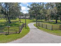 Long driveway leading to a home on a large lot at 373 Glenwood Rd, Deland, FL 32720