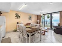 Bright dining area with ocean view and seating for four at 2301 S Atlantic Ave # 306, Daytona Beach Shores, FL 32118