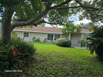 Charming single-story home with a well-manicured lawn at 1461 N Felton St, Deltona, FL 32725