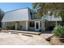 Inviting light teal building exterior with parking at 4150 S Atlantic Ave # 127A, New Smyrna Beach, FL 32169