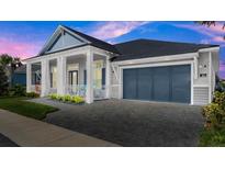 Two-story house with a large garage and porch at 53 Marden Dr, Ormond Beach, FL 32176