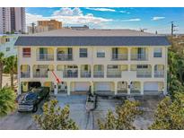 Front view of a three-story building with multiple units, each featuring a private entrance and garage at 3733 Cardinal Blvd # 6, Daytona Beach, FL 32118