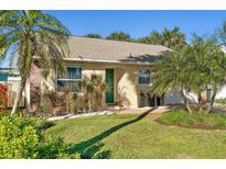 Charming single story home with green door and lush landscaping at 503 Phoenix Ave, Daytona Beach, FL 32118