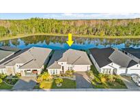 Aerial view of house near a lake at 588 Mosaic Blvd, Daytona Beach, FL 32124
