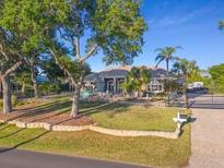Stunning two-story home with lush landscaping and gated entrance at 3765 John Anderson Dr, Ormond Beach, FL 32176