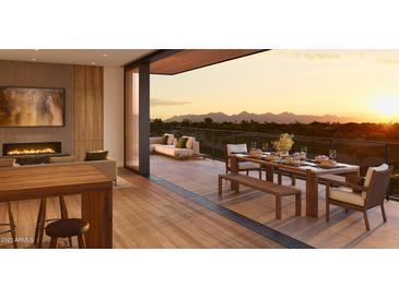 Spacious patio with mountain views, dining area, and seating at 4849 N Camelback Ridge Rd # A311, Scottsdale, AZ 85251