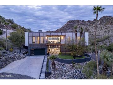 Modern home exterior with mountain views at dusk at 2150 E Belmont Ave, Phoenix, AZ 85020