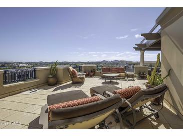Spacious patio with seating area, offering scenic city views at 7175 E Camelback Rd # 704, Scottsdale, AZ 85251