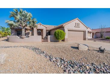 Single story home with desert landscaping and two-car garage at 20419 N Shadow Mountain Dr, Surprise, AZ 85374
