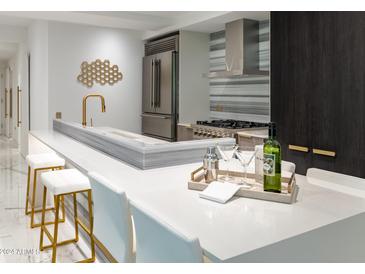 Modern kitchen with stainless steel appliances and an island at 7167 E Rancho Vista Dr # 3003, Scottsdale, AZ 85251