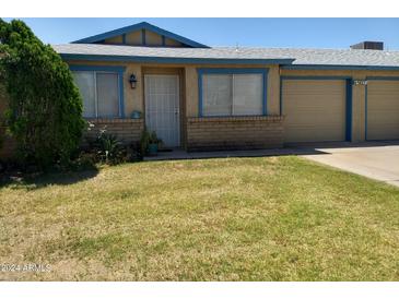 Cute one-story home with a grassy yard at 9627 W North Ln # B, Peoria, AZ 85345