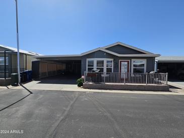 Gray house with a covered patio and a red door at 650 N Hawes Rd # 4507, Mesa, AZ 85207