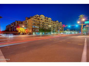 Night view of a modern apartment building with city lights at 2302 N Central N Ave # 302, Phoenix, AZ 85004