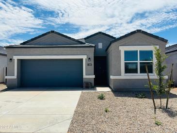 New single-story home with gray exterior and a two-car garage at 5203 E Midnight Star Dr, San Tan Valley, AZ 85143