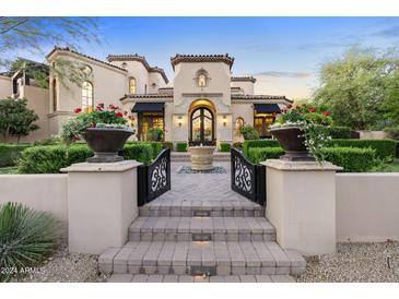 Grand estate with a courtyard and gated entrance at 9926 E Kemper Way, Scottsdale, AZ 85255
