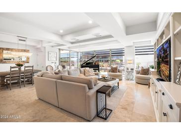 Open living area with ample seating and access to patio at 7117 E Rancho Vista Dr # 4011, Scottsdale, AZ 85251
