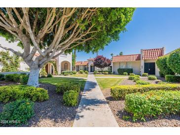 Attractive community courtyard with lush landscaping and walkways at 7113 E Mcdonald Dr, Paradise Valley, AZ 85253