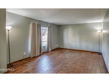 Bright living room with hardwood floors and neutral walls at 4443 W Solano S Dr, Glendale, AZ 85301