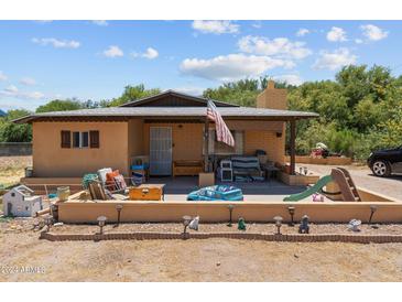 Cute one-story home with a front porch and landscaped yard at 331 W Center St, Wickenburg, AZ 85390