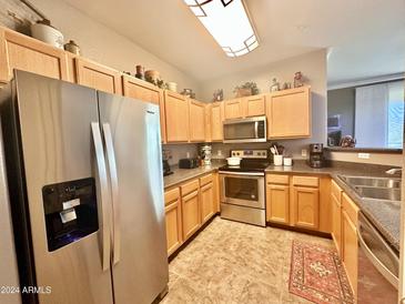 Well-equipped kitchen with stainless steel appliances at 20100 N 78Th Pl # 3090, Scottsdale, AZ 85255