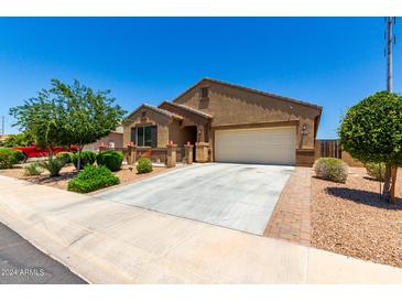 One story home with attached garage and landscaping at 20051 N Herbert Ave, Maricopa, AZ 85138