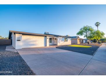 Updated Ranch home with new landscaping and driveway at 1873 E Ellis Dr, Tempe, AZ 85282