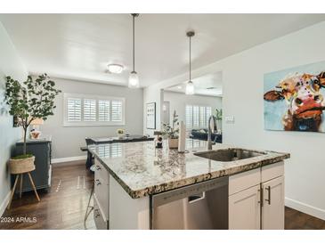 Modern kitchen with granite island and stainless steel appliances at 1408 W 7Th St, Tempe, AZ 85281