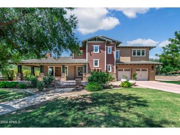 Two story home with craftsman style and mature trees at 13118 N Founders Park Blvd, Surprise, AZ 85379