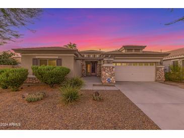 One-story home with a two-car garage and desert landscaping at 13820 W Cheery Lynn Rd, Avondale, AZ 85392